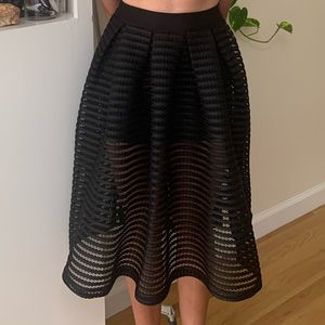 Black midi length mesh overlay mini skirt